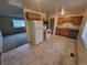 Functional kitchen boasts wooden cabinets and a tiled floor, accompanied by modern appliances and ample counter space at 8353 Gaylord St, Denver, CO 80229