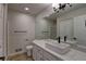 This modern bathroom has a large sink, marble countertops, and black fixtures at 1767 High Plains Ct, Superior, CO 80027