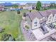 A bright exterior view of a multi-story townhome with professional landscaping and mountain views at 1767 High Plains Ct, Superior, CO 80027