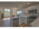 Open kitchen with stainless steel appliances, a central island, and a view into the living area at 1767 High Plains Ct, Superior, CO 80027