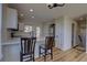 Kitchen featuring white cabinets, stainless steel appliances, and a breakfast bar with seating at 1767 High Plains Ct, Superior, CO 80027