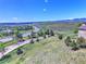 Scenic view of a wide landscape with a home, road, and mountain range in the distance at 1767 High Plains Ct, Superior, CO 80027
