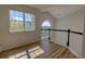 Bright living room has wood floors, windows, and a railing at 1767 High Plains Ct, Superior, CO 80027