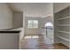 Spacious living room with wood floors, a window view, and built-in shelving at 1767 High Plains Ct, Superior, CO 80027