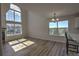 Spacious living area with hardwood floors, a fireplace, and large windows offering scenic views at 1767 High Plains Ct, Superior, CO 80027