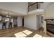 Open-concept living area showcasing hardwood floors, a fireplace, and a view of the upper level at 1767 High Plains Ct, Superior, CO 80027