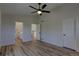 Spacious main bedroom featuring modern ceiling fan and wood-look floors at 1767 High Plains Ct, Superior, CO 80027