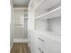 Walk-in closet featuring custom shelving and ample storage at 15628 W Baker Ave, Lakewood, CO 80228