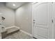Home entryway with tiled floor, stairs and a door leading outside; ready for new owners at 15628 W Baker Ave, Lakewood, CO 80228