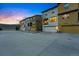 Townhome exteriors boast well-maintained landscaping, private garages, and ample parking at 15628 W Baker Ave, Lakewood, CO 80228
