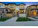 Inviting two-story home with well-manicured lawn and charming architectural details at 15628 W Baker Ave, Lakewood, CO 80228