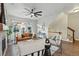 Inviting living room featuring stone fireplace, hardwood floors, and access to balcony at 15628 W Baker Ave, Lakewood, CO 80228
