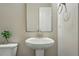 Stylish powder room with pedestal sink and modern fixtures at 15628 W Baker Ave, Lakewood, CO 80228
