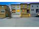 Attractive townhomes boast attached garages and well-maintained landscaping at 15628 W Baker Ave, Lakewood, CO 80228