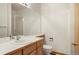 Bathroom featuring a large mirror, a toilet and a shower at 18806 E Saratoga Cir, Aurora, CO 80015