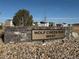 Inviting Wolf Creek Run West community entrance sign set amongst new homes and manicured grounds at 3003 Pershing St, Strasburg, CO 80136