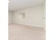 Bright, finished basement room with mirrored wall and carpeted floor at 6620 E Virginia Ave, Denver, CO 80224