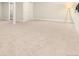 Finished basement with neutral carpet and ample space at 6620 E Virginia Ave, Denver, CO 80224