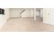 Finished basement area with neutral carpet and extra storage at 6620 E Virginia Ave, Denver, CO 80224