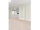 Spacious finished basement with neutral carpeting and built-in shelving at 6620 E Virginia Ave, Denver, CO 80224