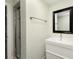 Basement bathroom with modern vanity and shower at 6620 E Virginia Ave, Denver, CO 80224