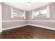 Spacious bedroom with hardwood floors and large windows at 6620 E Virginia Ave, Denver, CO 80224