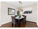 Elegant dining room with dark wood table and chairs at 6620 E Virginia Ave, Denver, CO 80224