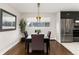 Modern dining area with stylish light fixture at 6620 E Virginia Ave, Denver, CO 80224