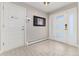 Bright and spacious entryway with tile flooring and modern light fixture at 6620 E Virginia Ave, Denver, CO 80224