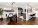 Modern kitchen with breakfast bar and stainless steel appliances at 6620 E Virginia Ave, Denver, CO 80224