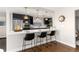 Updated kitchen featuring a breakfast bar and pendant lights at 6620 E Virginia Ave, Denver, CO 80224