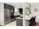 Sleek kitchen with stainless steel appliances and white countertops at 6620 E Virginia Ave, Denver, CO 80224