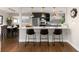 Modern kitchen with breakfast bar and pendant lights at 6620 E Virginia Ave, Denver, CO 80224