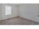 Bedroom featuring neutral colored carpeting and natural light at 27604 E Byers Ave, Aurora, CO 80018