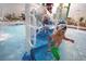 Community waterpark offers wet fun in the sun, featuring slides, waterfalls, and a pool at 27604 E Byers Ave, Aurora, CO 80018