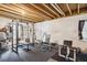 Spacious basement fitness area with exposed ceiling, ideal for personal training and fitness at 21063 E Greenwood Pl, Aurora, CO 80013