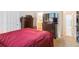 Comfortable carpeted bedroom with dresser and large television for a relaxing and comfortable setting at 21063 E Greenwood Pl, Aurora, CO 80013