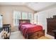 Bedroom featuring large windows, high vaulted ceilings, a crib, and abundant natural light at 21063 E Greenwood Pl, Aurora, CO 80013