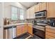 Modern kitchen featuring stainless steel appliances and granite countertops at 21063 E Greenwood Pl, Aurora, CO 80013