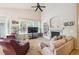 Bright living room with a fireplace, large windows, and vaulted ceilings at 21063 E Greenwood Pl, Aurora, CO 80013
