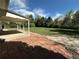 Backyard with a brick patio and large grassy area at 1836 E Mineral Ave, Centennial, CO 80122