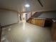 The unfinished basement features paneled walls, stairs and built-in cabinets at 1836 E Mineral Ave, Centennial, CO 80122