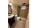 This bathroom features a tile walk-in shower with a grab bar, a vanity, and standard toilet at 1836 E Mineral Ave, Centennial, CO 80122