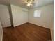 Bedroom with hardwood floors, closet, and window at 1836 E Mineral Ave, Centennial, CO 80122