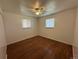 Bright bedroom with hardwood floors and dual windows at 1836 E Mineral Ave, Centennial, CO 80122