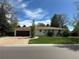 Charming single-story home with a well-maintained lawn and attached garage at 1836 E Mineral Ave, Centennial, CO 80122