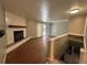 Bright living room with hardwood floors, fireplace, and sliding glass door to outdoor space at 1836 E Mineral Ave, Centennial, CO 80122