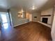 Spacious living room with hardwood floors, fireplace, and natural light at 1836 E Mineral Ave, Centennial, CO 80122