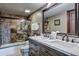 Bathroom featuring a double sink vanity and luxurious tiled shower and bathtub at 185 S Fuller Placer Rd, Breckenridge, CO 80424