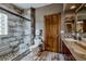 Bathroom featuring a glass-enclosed shower, stone accents, and stylish fixtures at 185 S Fuller Placer Rd, Breckenridge, CO 80424